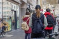 People queue and social distancing outside in front of food stall and supermarket during quarantine for COVID-19 virus in Europe. Royalty Free Stock Photo