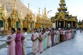People queued with offers in the area of the Shwedagon Pagoda in