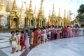 People queued with offers in the area of the Shwedagon Pagoda in