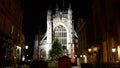 People queuing and entering Christmas Midnight Mass at Bath Abbey