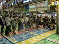 People queuing at Shinagawa station in Tokyo, Japan