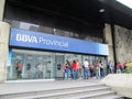 People queuing to withdraw money from ATMs of the BBVA Provincial Bank, at its headquarters