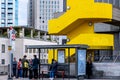 People Queuing And Waiting At A bus Stop Or Bus Shelter On Waterloo Bridge