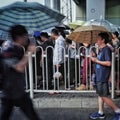 People in rain in beijing wudaokou station Royalty Free Stock Photo