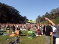 People raise hands into the air doing yoga