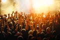 People with raised hands at a public event. Gathering in concert hall