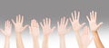 People raising hands for participation, many people`s hands up. teamwork and competition concept