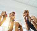 People raising their arms hands and holding each others hands to protest together gesture as a team and group in unity Royalty Free Stock Photo