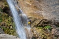 People rappelling in an impressive waterfall Royalty Free Stock Photo