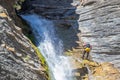 People rappelling in an impressive waterfall Royalty Free Stock Photo
