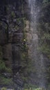 People rappelling in the middle of nature with waterfalls in Ecuador