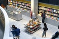 People reading and shopping at new cultural center of the Isla de la Cartuja. Seville, Spain.
