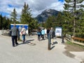 People reading the sign for the Spiral Tunnels for Trains in Yoho National Park in Canada