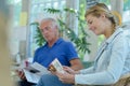 People reading in waiting room Royalty Free Stock Photo