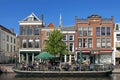 People recreating on sunny boat terrace in Leiden