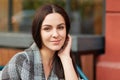 People, recreation and beauty concept. Pleasant looking brunette female with healthy skin, dark hair, looks pleased at camera, lis Royalty Free Stock Photo