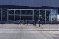 People reflecting in glass windows, distorted view, blurred