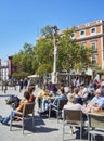 People refreshing on a terrace in the Jacinto Benavente square of Madrid, Spain