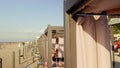 People relacing at a beach Cabana with view over sea