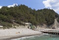 People relax on the beach close to post of coast guards. Praskoveevka, Gelendzhik district, Krasnodar region, Russia