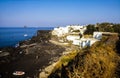 People relax at the empty volcanic beach of Ginostra