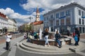 People relax at the fountain at the Town Hall square in Vilnius, Lithuania.