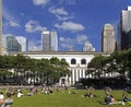 People relax on lawn of Bryant Park NYC Royalty Free Stock Photo