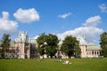 People relax on the lawn and have a picnic near the historic building. Russia, Moscow, Tsaritsyno - 09 01 2019