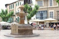 People relax at the main square in Soller, Mallorca, Spain