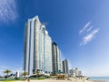 People relax near the pier in Sunny Isles Beach