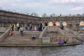 People relax on the Neva River