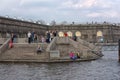 People relax on the Neva River