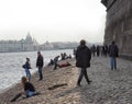 People relax on the Neva River