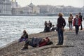 People relax on the Neva River