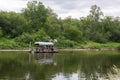 People relax on primitive raft during rafting on River. Tourists rafting, floating. Russia, Bashkortostan, July 2019