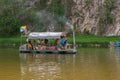 People relax on primitive raft during rafting on River. Tourists rafting, floating. Russia, Bashkortostan, July 2019