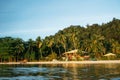 People relax on tropical beach of Port Barton