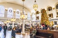 People relax and wait for train inside of historic Union Station in Denver, Colorado