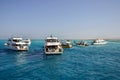 People relax on yacht sea on sunny day. Picturesque seascape with several yachts with vacationing tourists. Leisure on Red Sea,