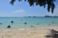 People relaxing on the beach.Tourists come and play the sea. Royalty Free Stock Photo