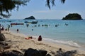 People relaxing on the beach.Tourists come and play the sea. Royalty Free Stock Photo