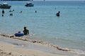 People relaxing on the beach.Tourists come and play the sea. Royalty Free Stock Photo