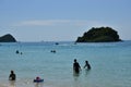 People relaxing on the beach.Tourists come and play the sea. Royalty Free Stock Photo