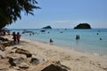 People relaxing on the beach.Tourists come and play the sea. Royalty Free Stock Photo