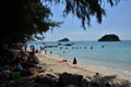 People relaxing on the beach.Tourists come and play the sea. Royalty Free Stock Photo