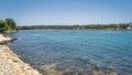 People relaxing in clear waters of Zaton bay with rocky coastline  Croatia Royalty Free Stock Photo