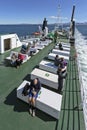 People relaxing on the deck of the Icelandic ferry boat on the way to West Fjords Royalty Free Stock Photo