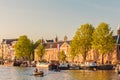 People relaxing on the Dutch Amstel river with the Hermitage mus