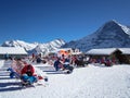 People relaxing and enjoying the sun after skiing on MÃÂ¤nnlichen, Jungraujoch ski region, Switzerland, Europe