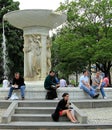 People relaxing in front of Daniel Chester French`s marble fountain in the center of Dupont Circle in Washington DC Royalty Free Stock Photo